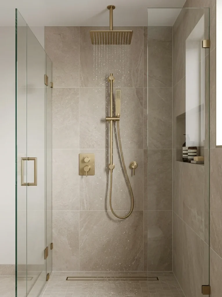 Adjustable handheld shower head beside a rainfall shower.