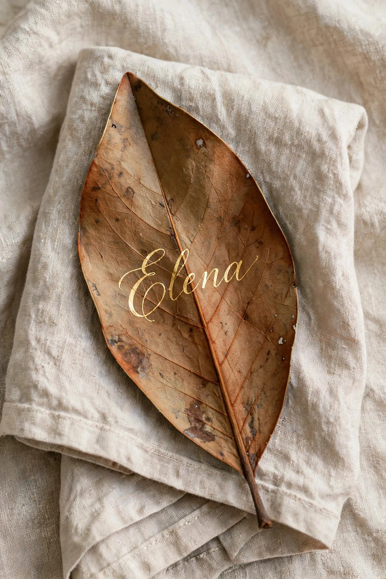 Handwritten name on a dried leaf place card